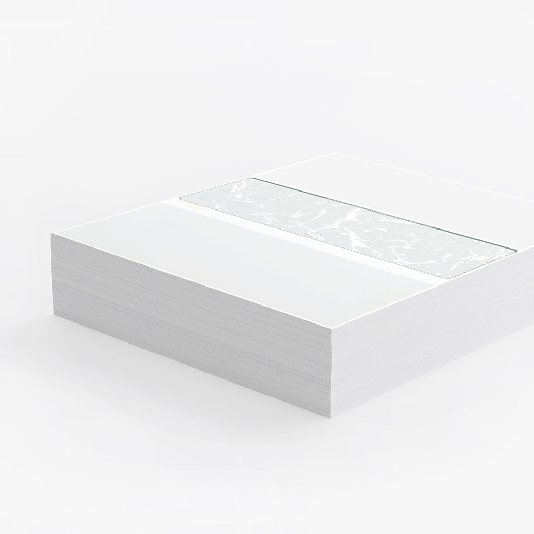 a ream of blank check paper set against a clean gray background